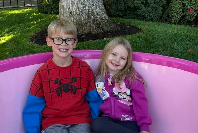 Children sitting and smiling